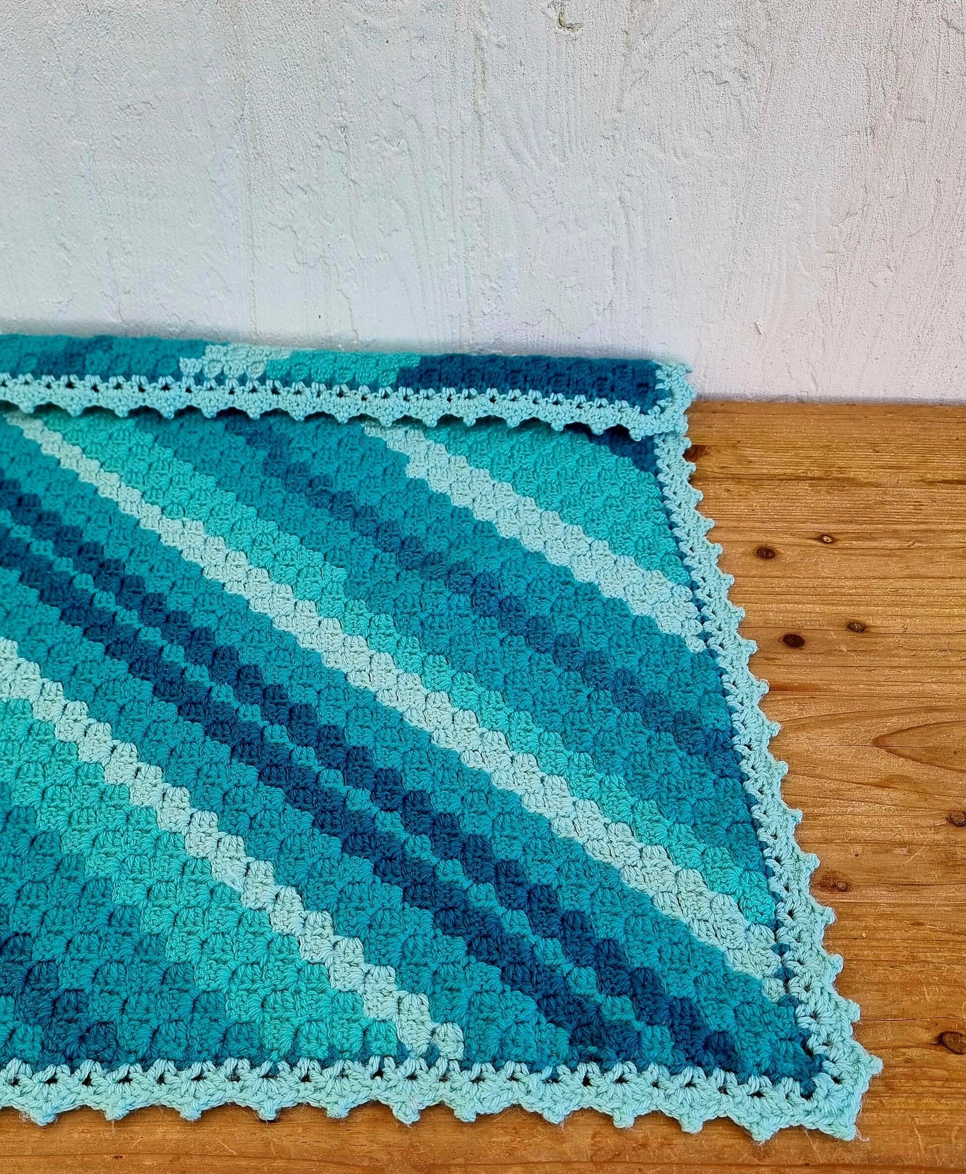 Vintage turquoise and lagoon blue crochet child’s blanket