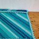 Vintage turquoise and lagoon blue crochet child’s blanket