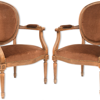 Pair of Louis XVI style convertible armchairs