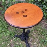 Pedestal table with inlaid top and flower decoration