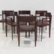 Set of six Italian wooden dining chairs in dark brown faux leather.