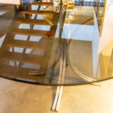 Table ovale en verre fumé et inox