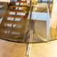 Table ovale en verre fumé et inox