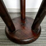 Dark wooden tripod stool