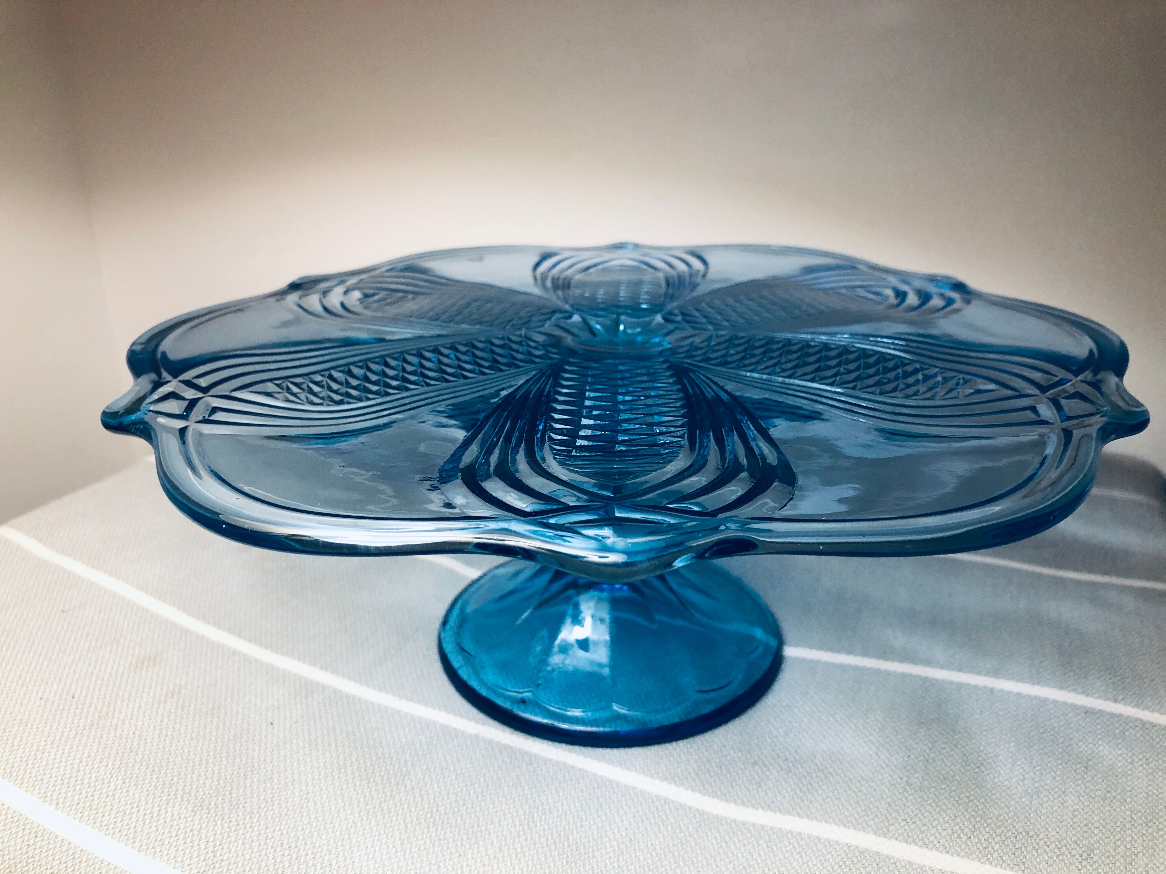 Blue vintage glass cake display