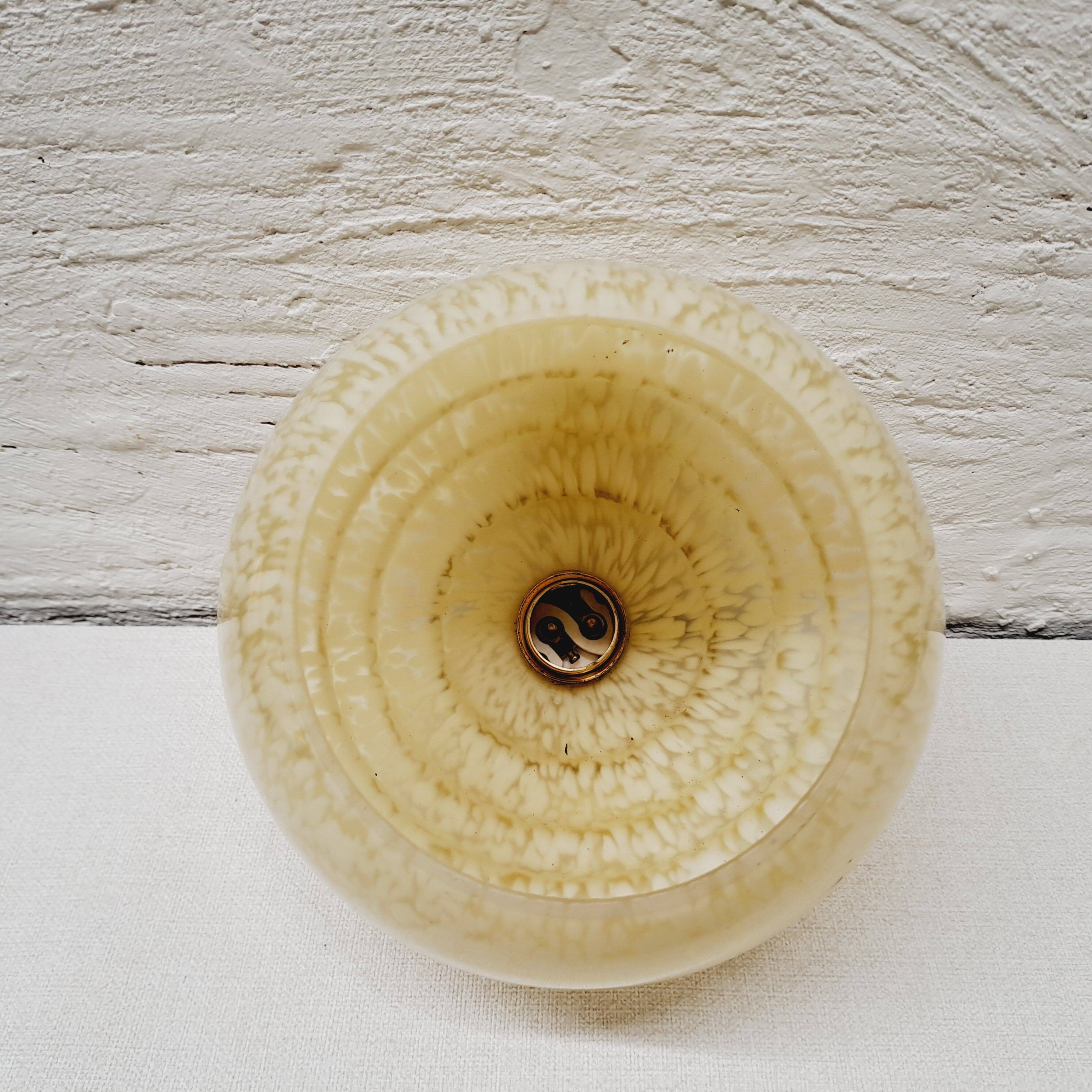 Pale yellow clichy glass globe