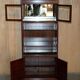 Set of three vintage hardwood military-style bookshelves.