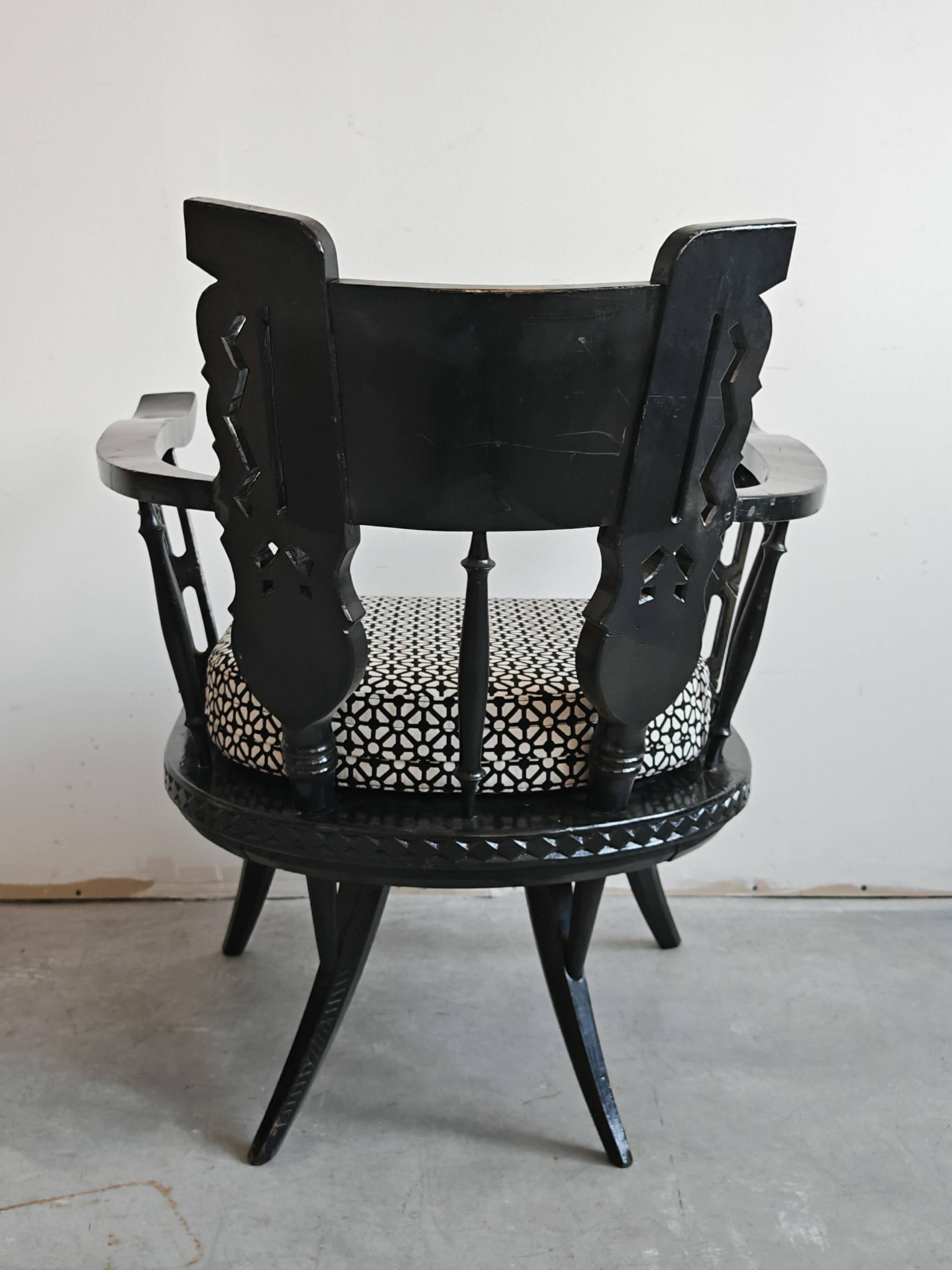 Pair of antique hand-carved armchairs in black lacquer from the 1920s.