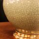 Ceramic lamp with a crackled celadon green finish.