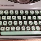 Hermès Baby lime green typewriter with suitcase