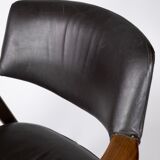 Armchair in rosewood and black leather of danish design from 1976.