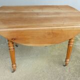 Cherry wood shuttered table.