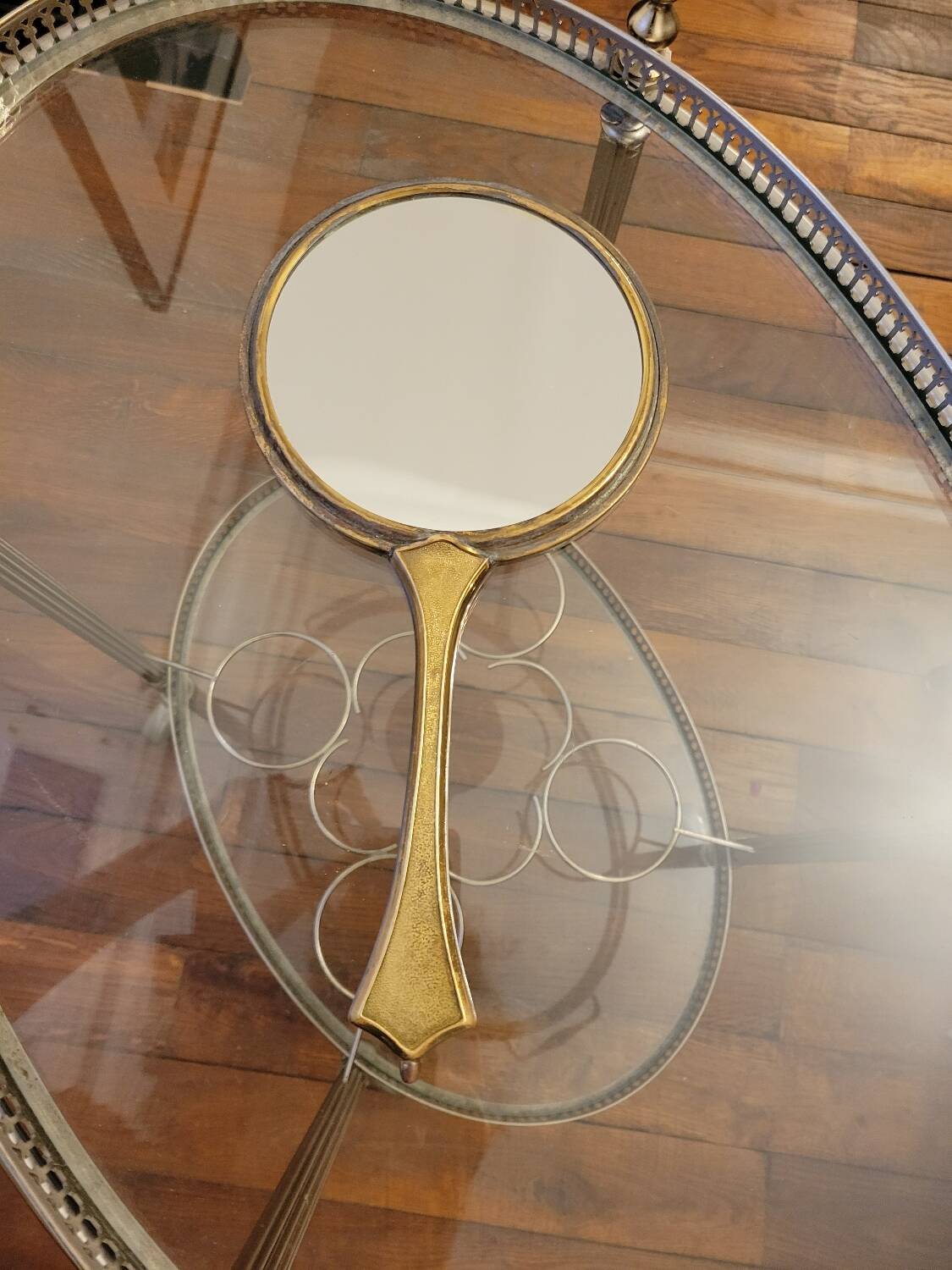 Brass hand mirror with magnifying back
