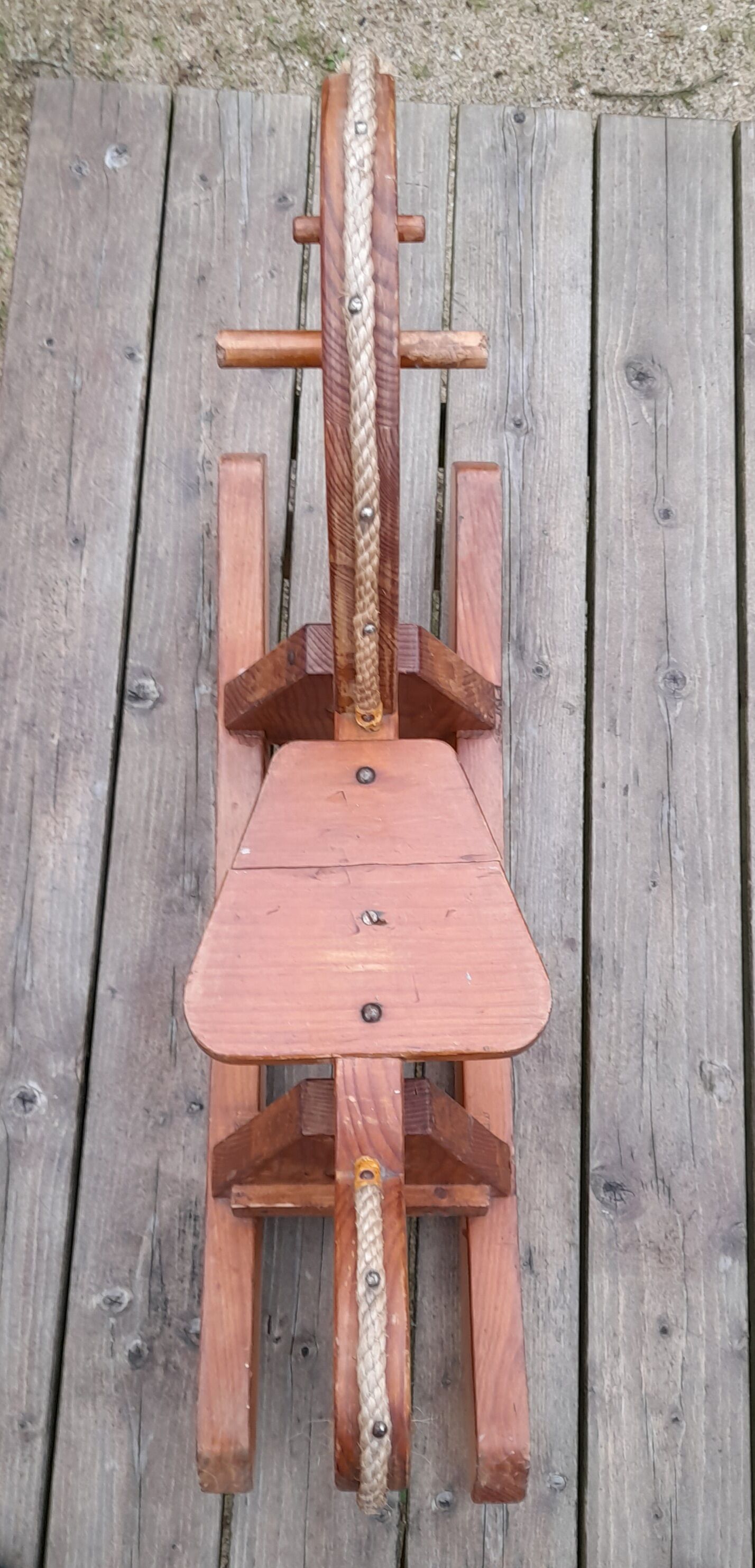 Rocking horse in raw and glazed wood