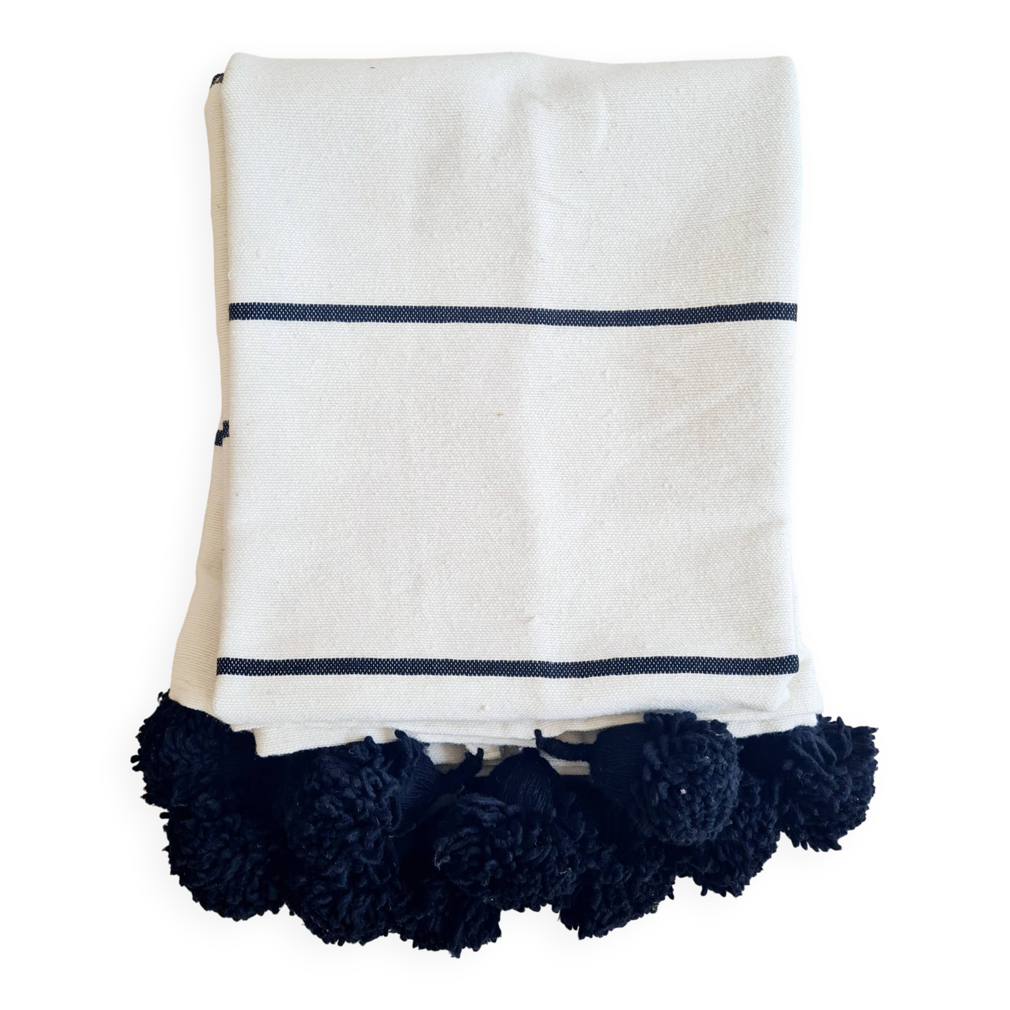 Handwoven throw with black stripes and pom-poms
