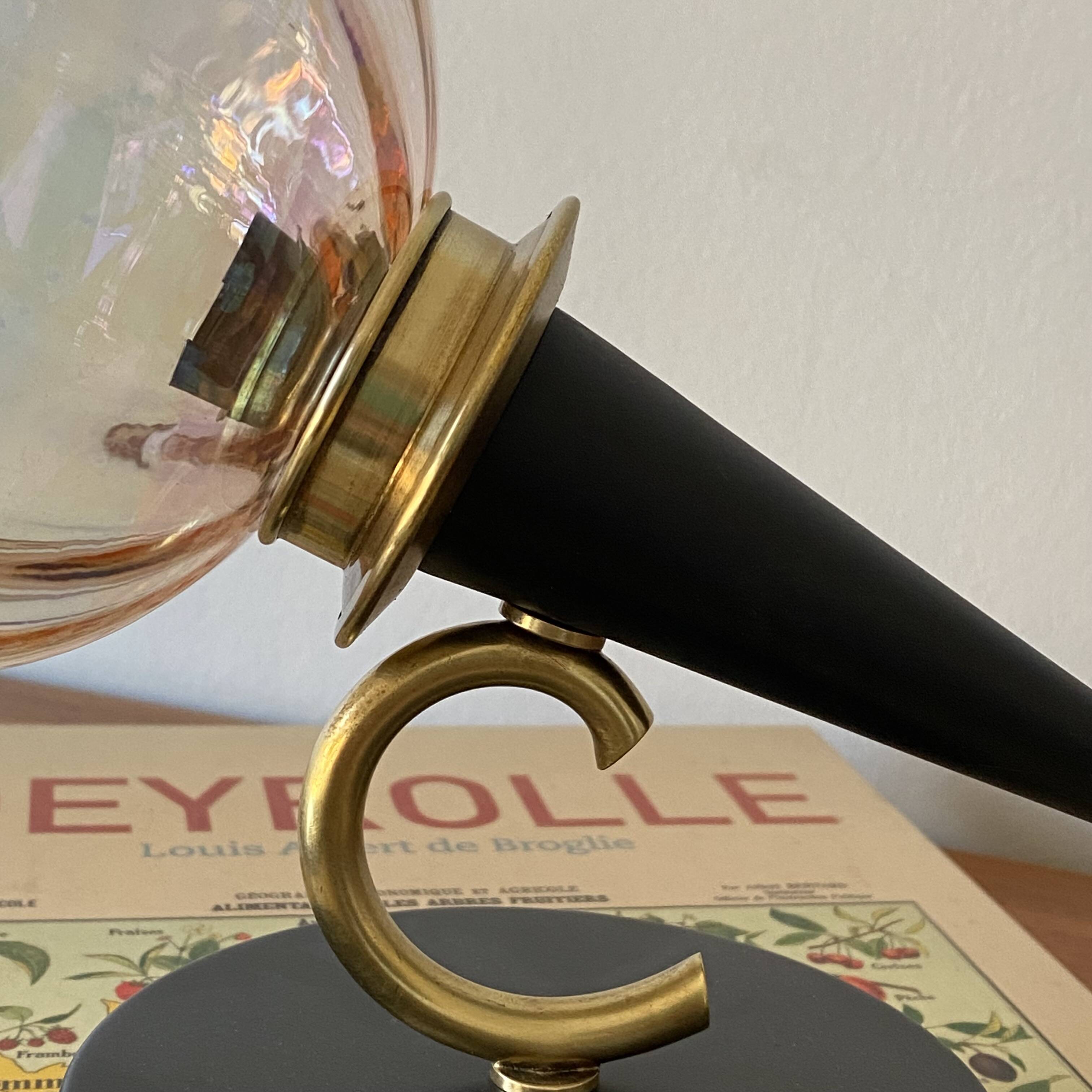 Pair of torch wall lights with iridescent pink glass shades and gold trim.