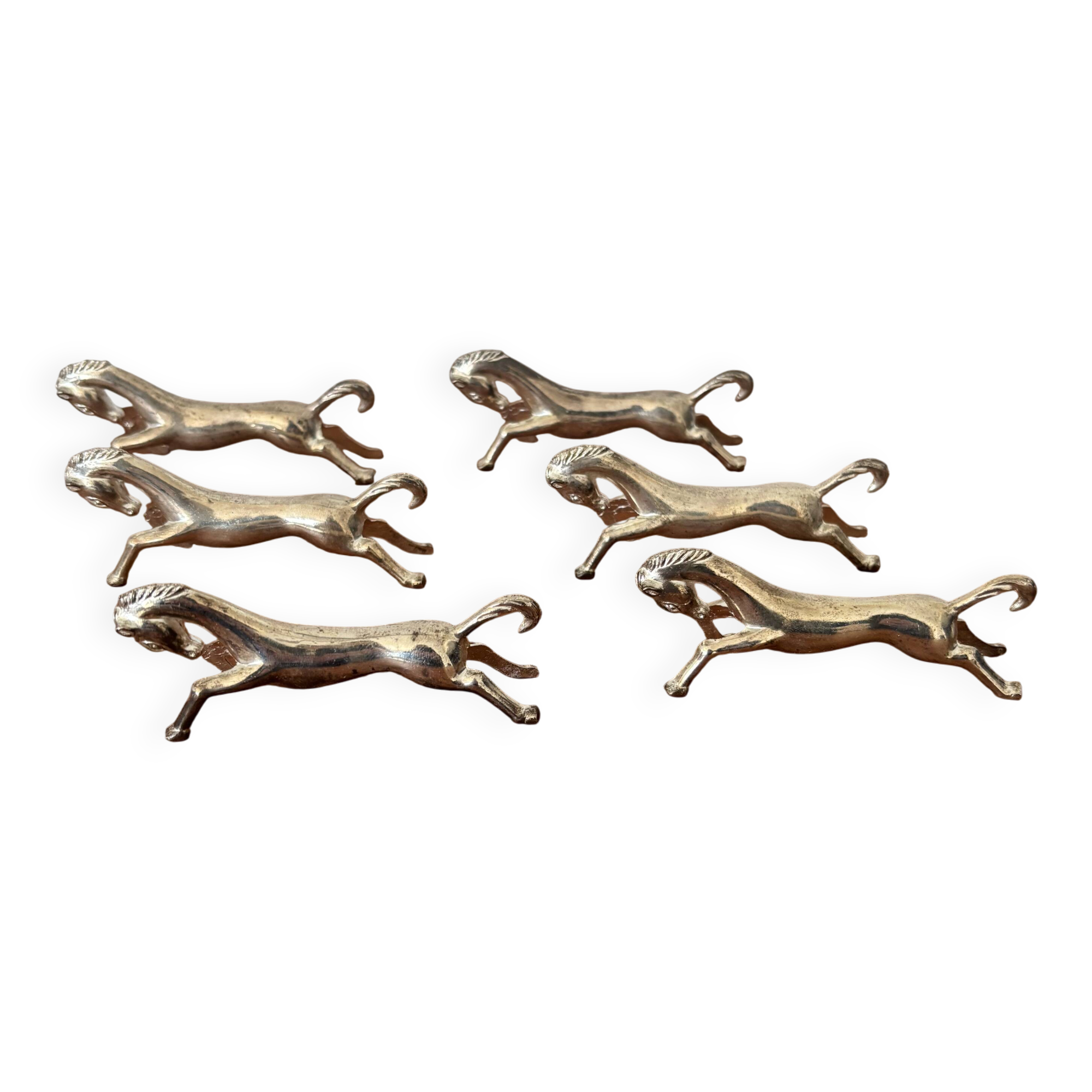 Set of 6 vintage galloping horse knife rests in silver-plated metal.