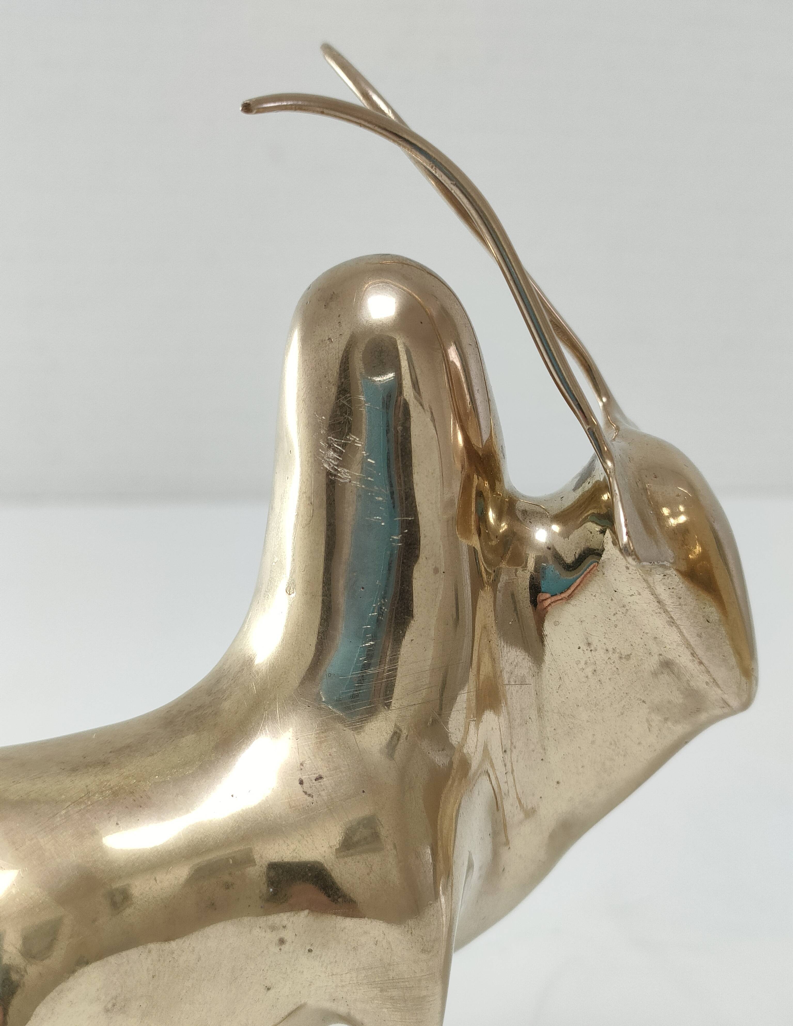 Two stylized zebu with long vintage brass horns