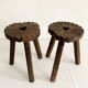 Pair of tripod farmhouse stools with clover pattern