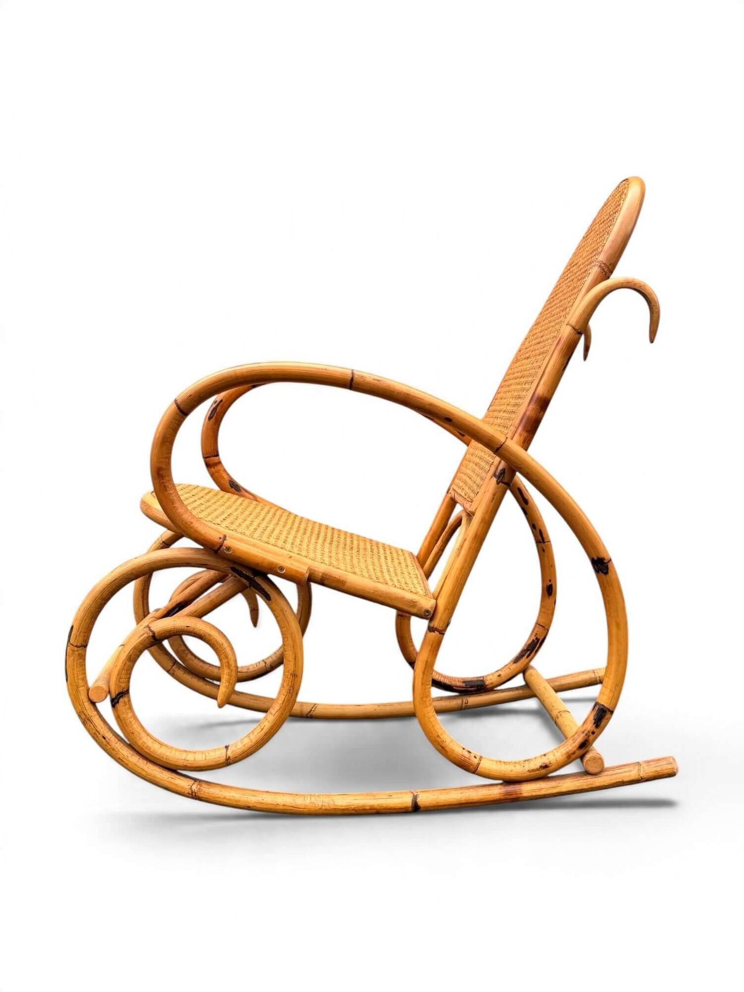 Vintage rocking chair in bamboo and cane