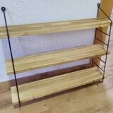 Pretty String shelf in very good condition.