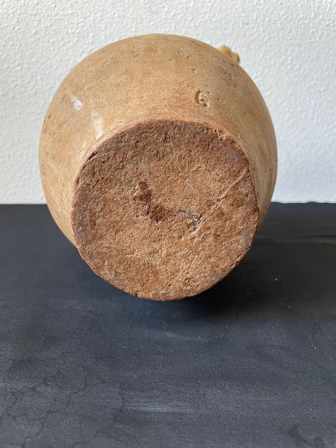 Old candied pot in yellow glazed terracotta