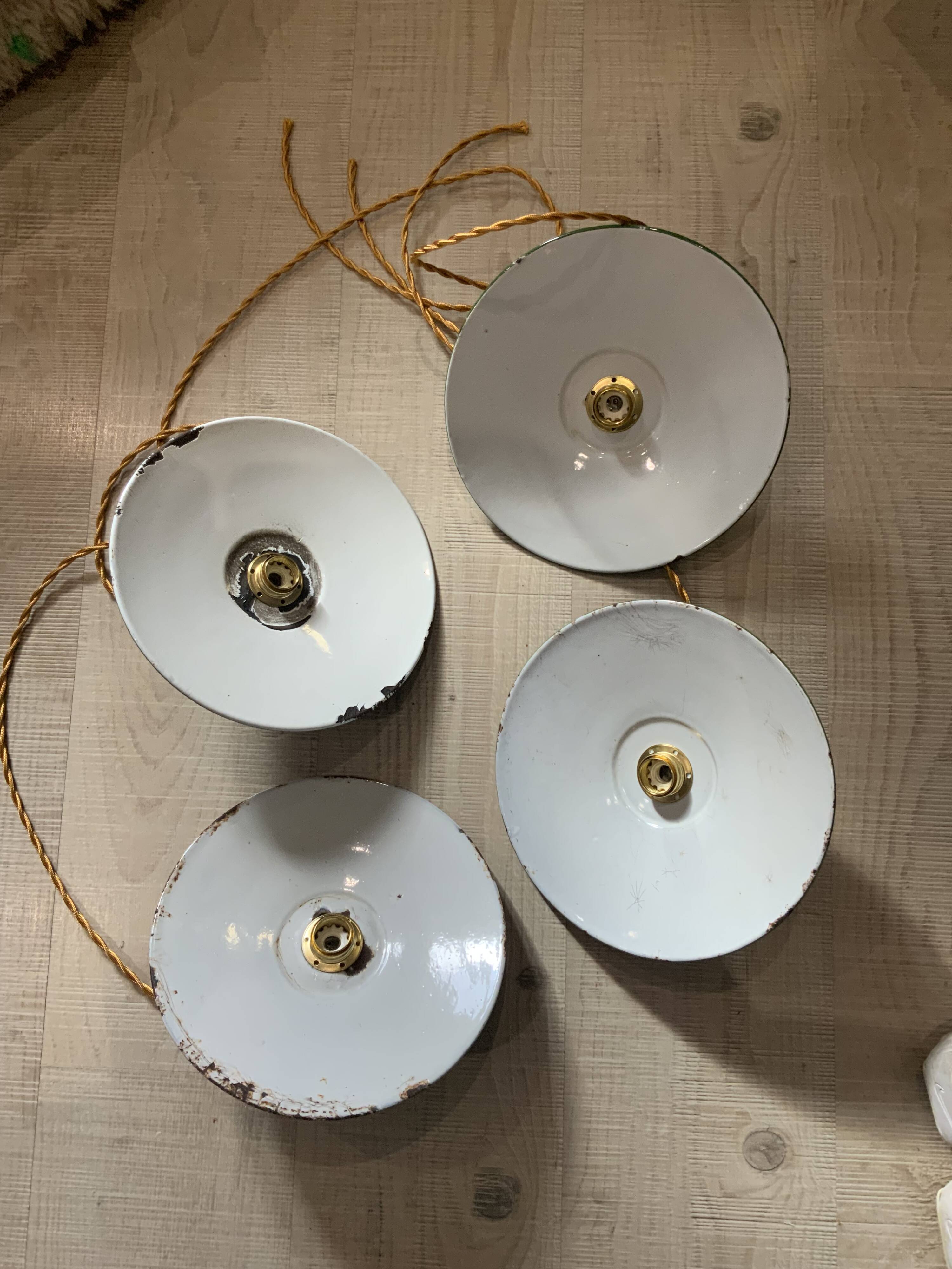 Vintage industrial enameled sheet metal pendant lights with golden wires, old green and white lampshade