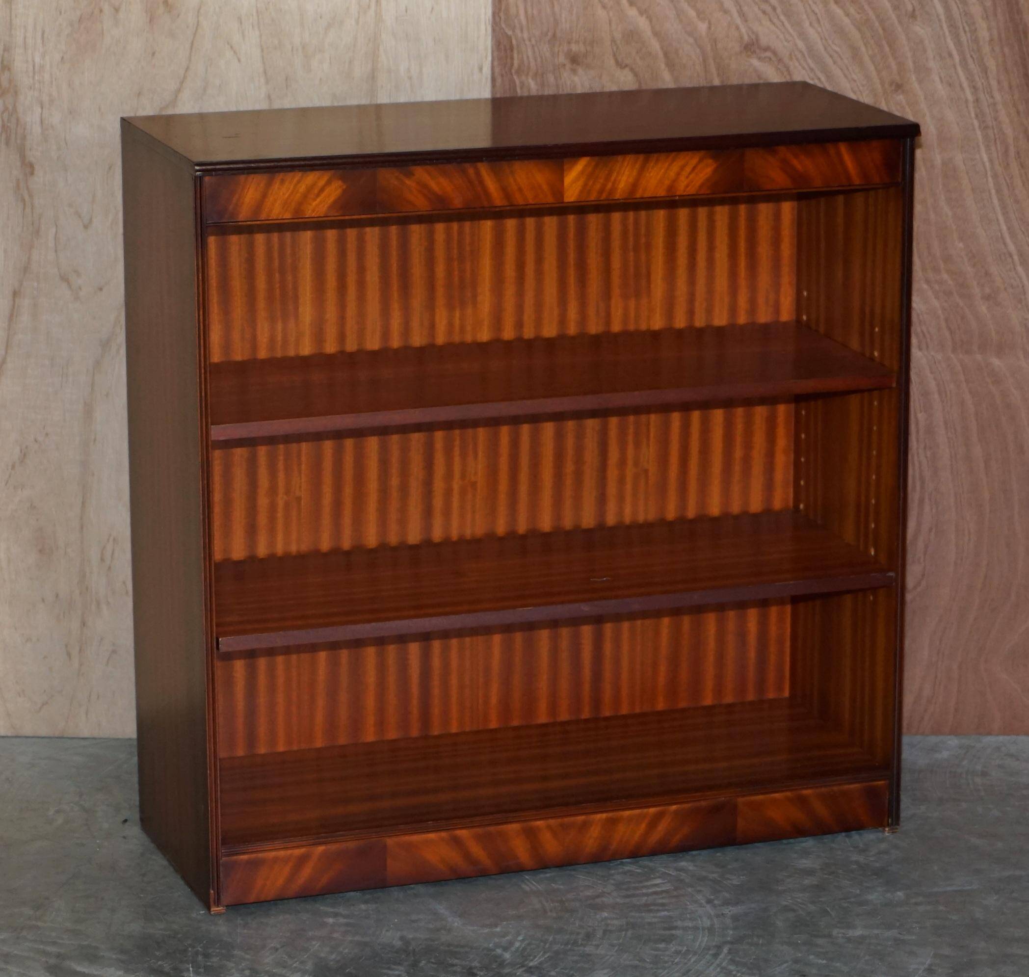 Pair of open low bookshelves Shaws of London in hardwood.