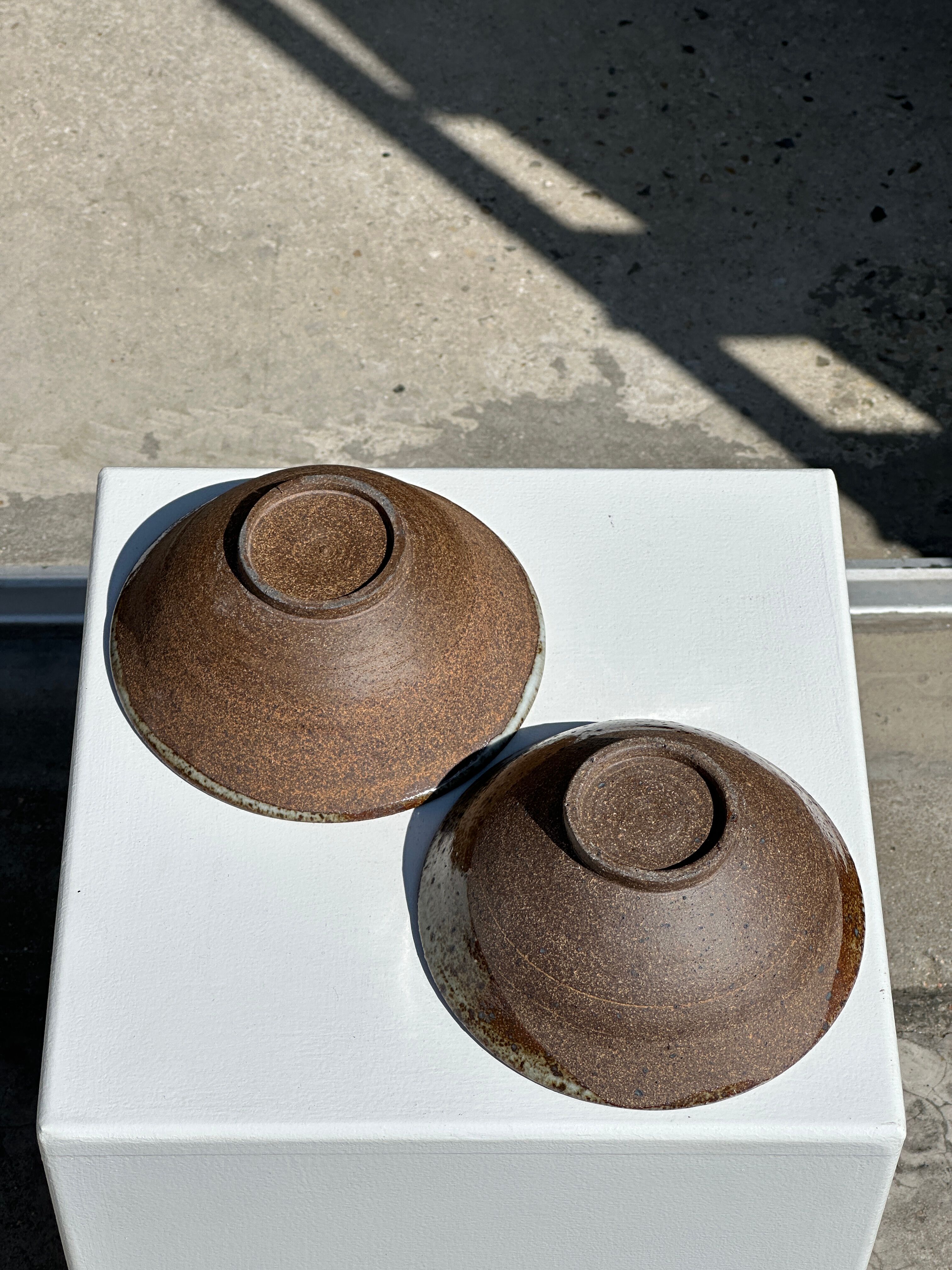 Duo of ceramic bowls interior glazed exterior matt raw earth