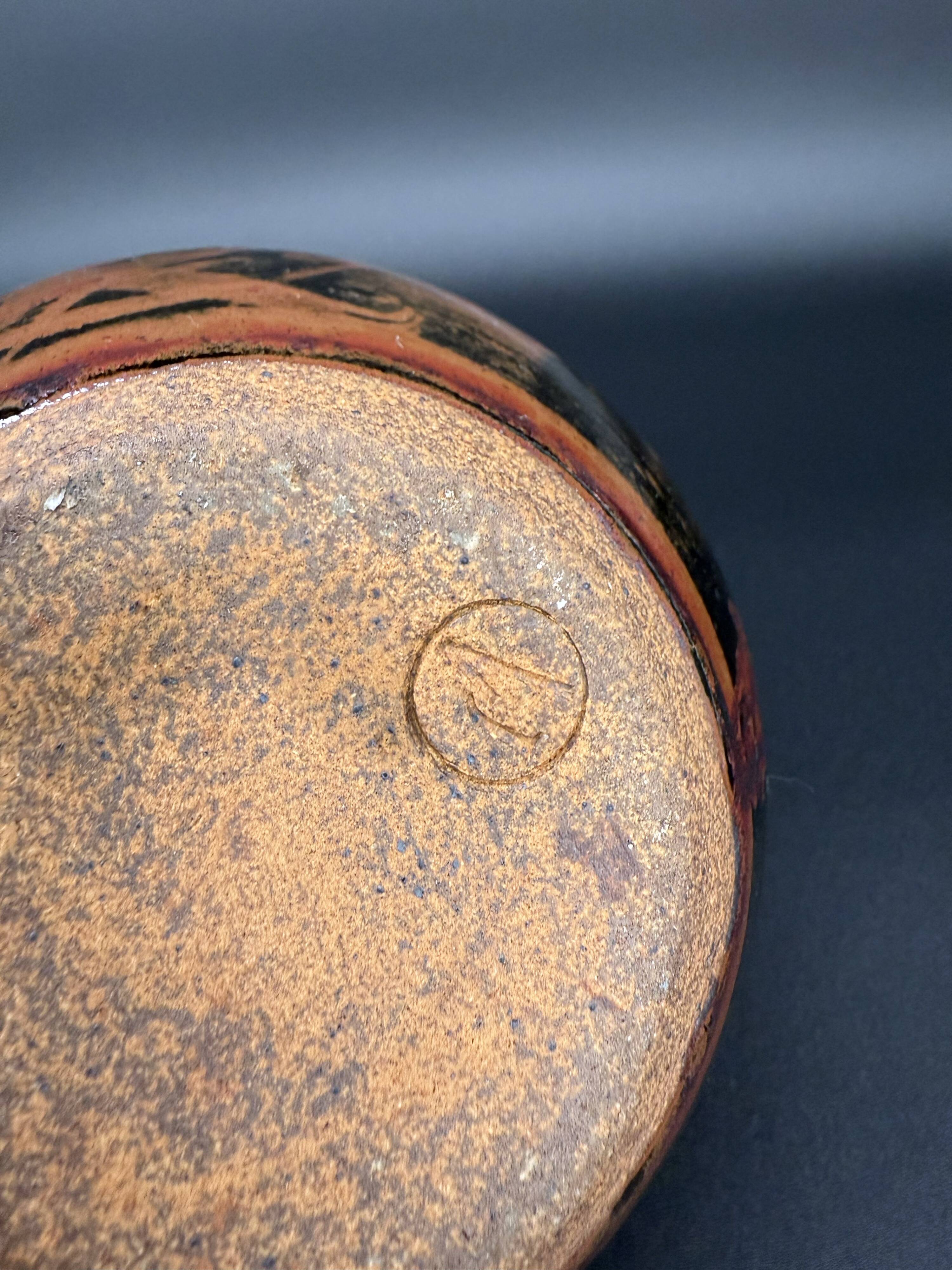 Signed black and red glazed stoneware pitcher, French artisanal ceramics