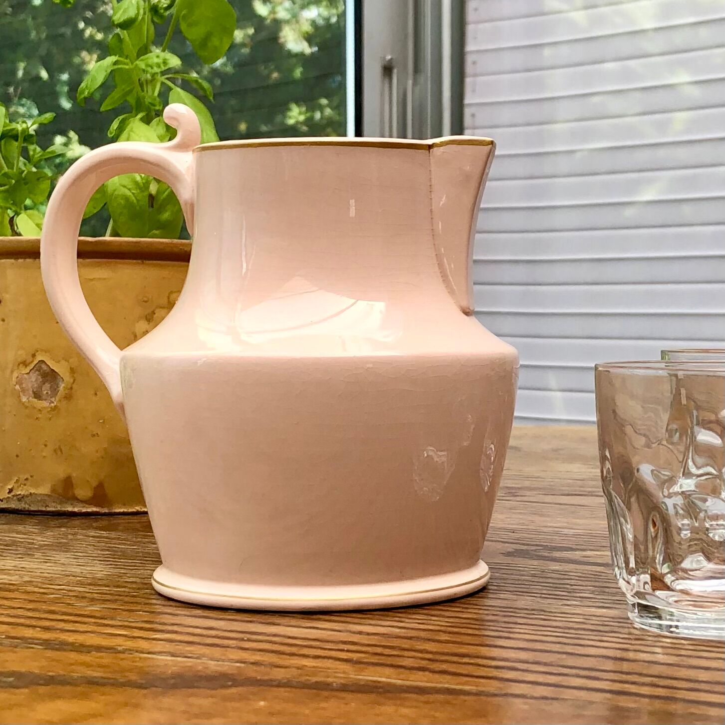 Antique pitcher in pink ceramic