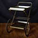 Vintage rolling trolley in gold metal & smoked glass – Retro elegance as
