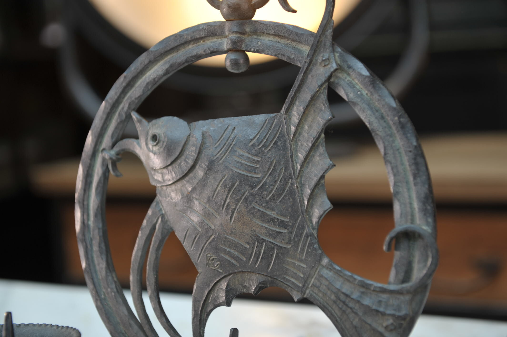 Pair of carved metal wall lamps signed RG