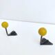 Two coat racks hooks balls yellow wood