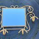 Wall-mounted gilded wrought iron coat rack with mirror