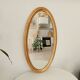 Miroir vintage ovale en bois doré années 60 77*41 cm