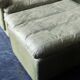 Fauteuil et pouf en cuir patchwork vert olive par Laauser, années 1970