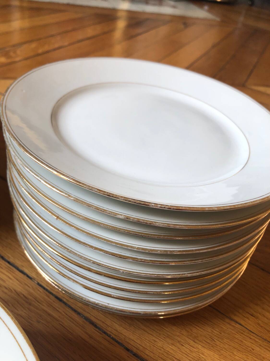Lot of 28 porcelain plates with golden edging