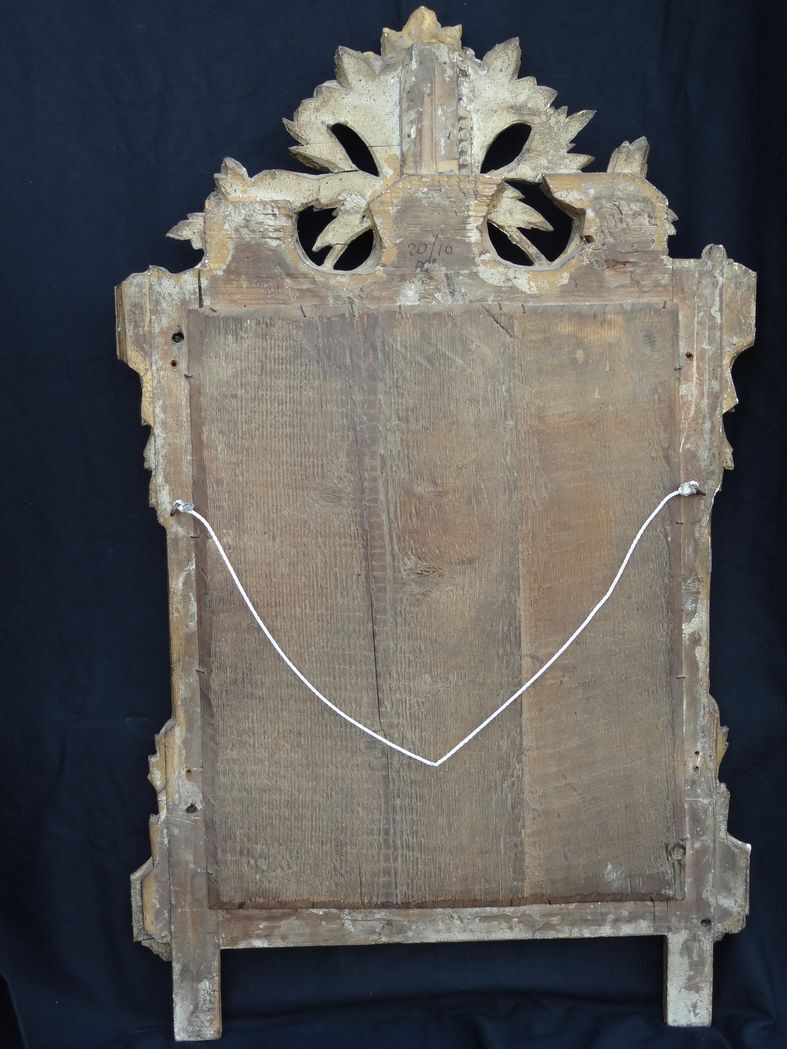 Louis XVI period mirror in gilded carved wood