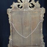 Louis XVI period mirror in gilded carved wood