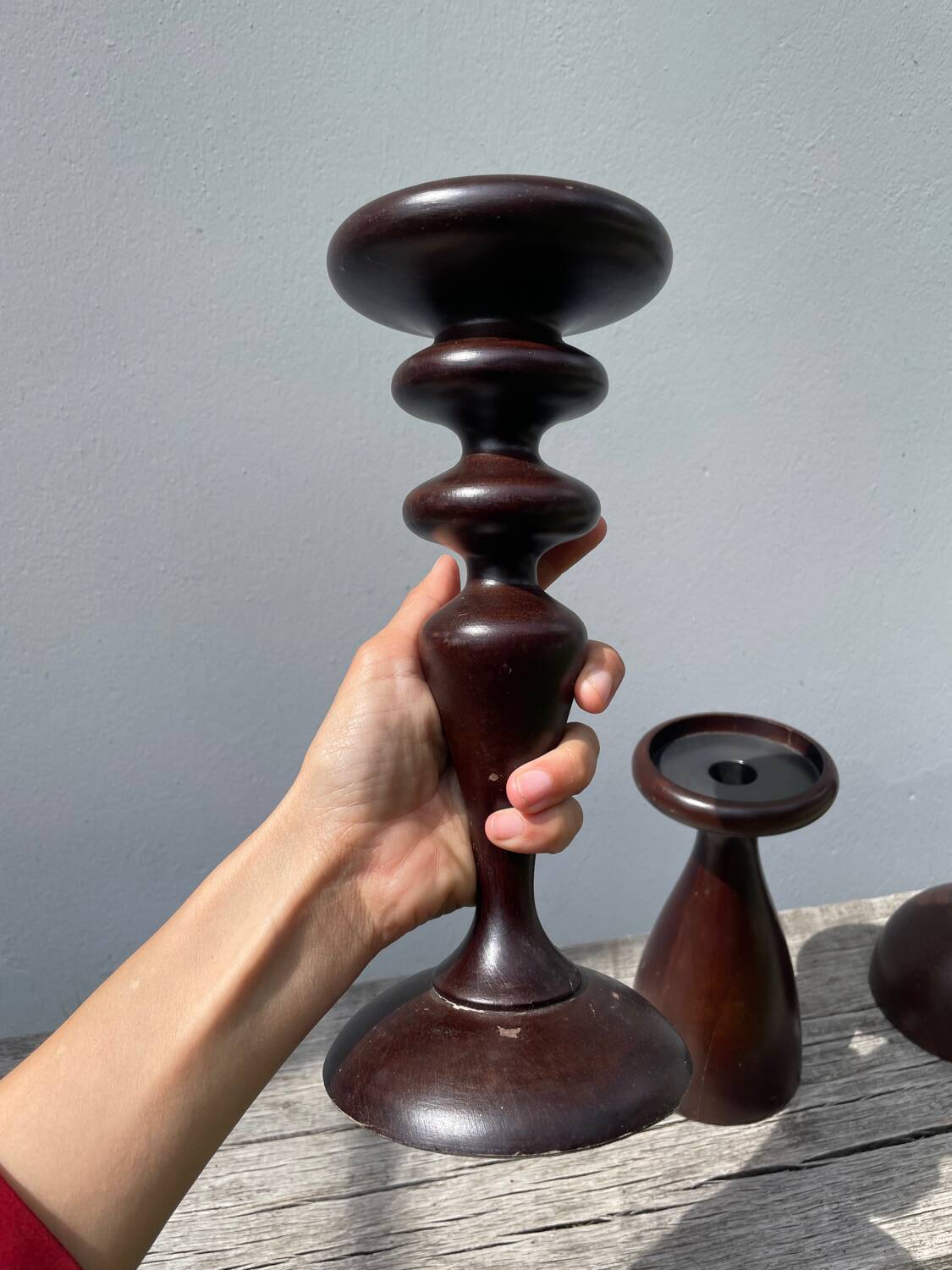Trio of large turned wooden candlesticks
