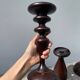Trio of large turned wooden candlesticks