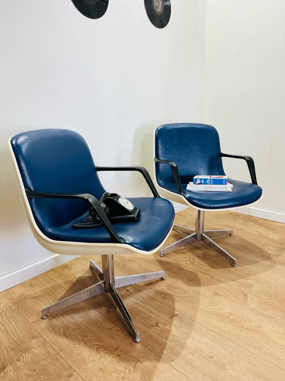 2 office chairs attr. to Strafor, white molded plastic shell, blue skai and chrome metal star base