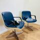 2 office chairs attr. to Strafor, white molded plastic shell, blue skai and chrome metal star base