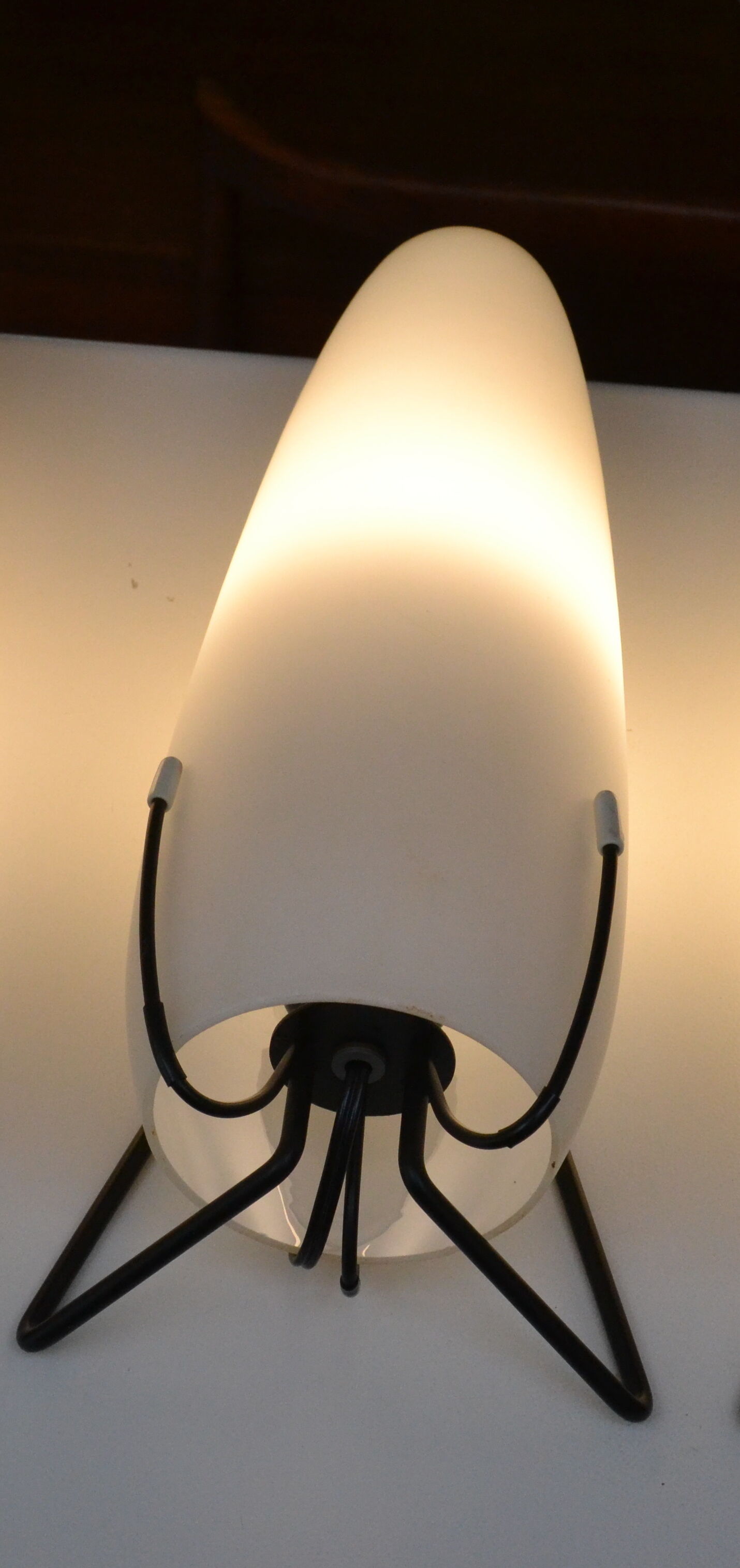 Louis Kalff opaline and metal wall light from the 1950s.