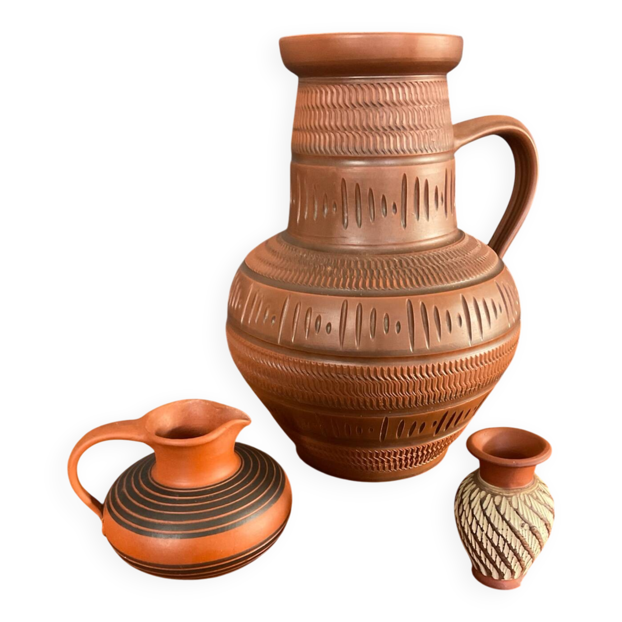 Trio of vintage vases in chiselled terracotta
