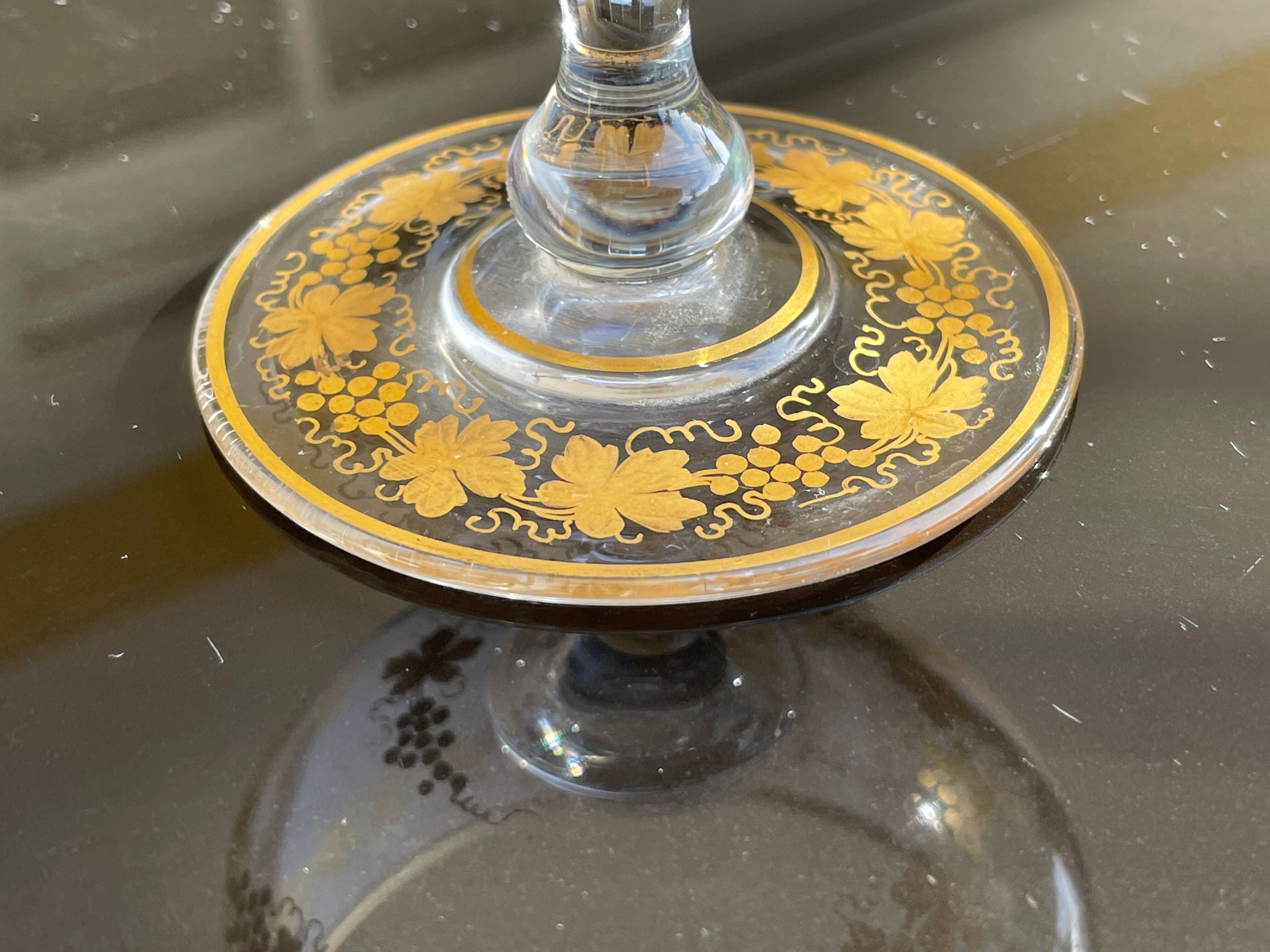 Glass cup decorated with golden vine decoration