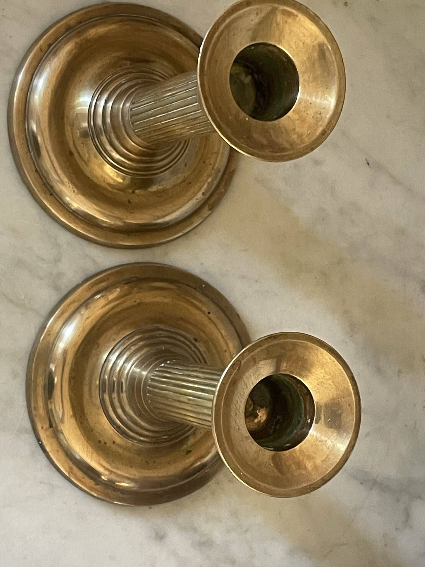Pair of fluted column candlesticks in brass