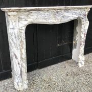 Cheminée en marbre brèche violette de style Louis XV