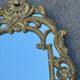 Large mirror with carved and gilded wooden frame, in Regency style.